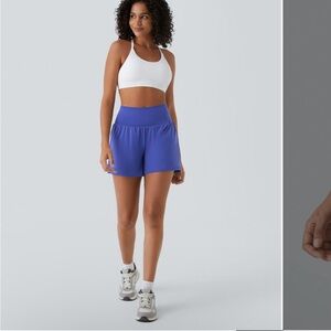 Halara high waisted shorts medium long. Never worn with tags